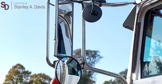 A truck driver's side-view mirror