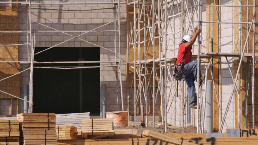 Man climbing on a scaffold