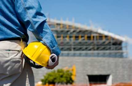 Worker looking at a construction site