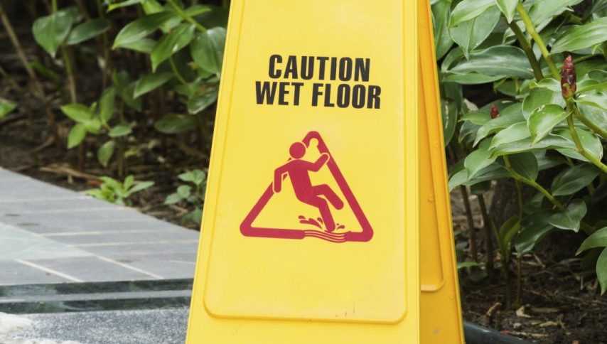 Image of wet floor sign in garden