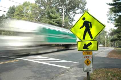 truck driving past a pedestrian crosswalk